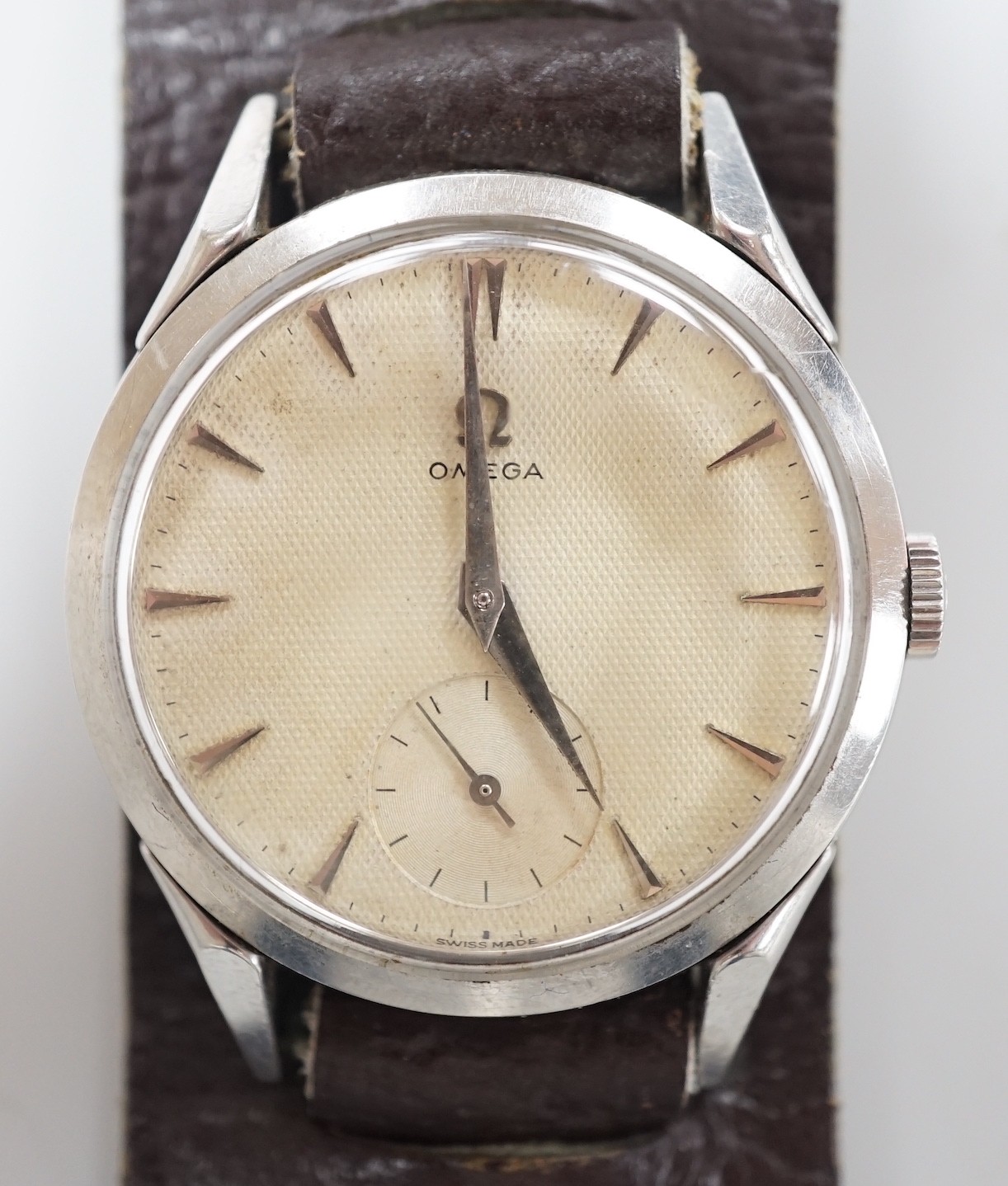 A gentleman's early 1950's stainless steel Omega wrist watch, with baton numerals and subsidiary seconds, movement c.266, on associated leather strap, case diameter 36mm.